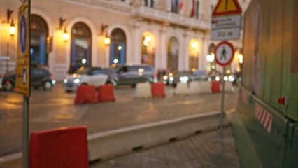 Defocused night scene in rome with blurred city lights, bokeh effect, and atmospheric street ambiance highlighting an old town in italy.