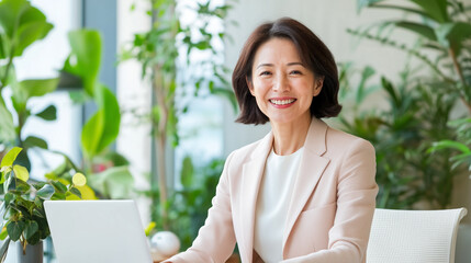 Professional woman smiling in modern office with greenery