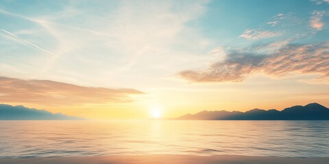 Vibrant sunset over tranquil waters with distant mountains in clear sky landscape