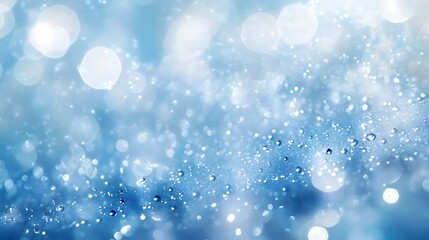 Minimal water droplet scattering light softly over a serene blue background