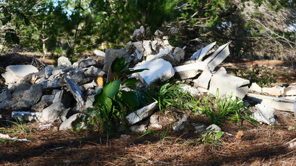 Waste from construction work close-up, illegal dumping of garbage in nature, environmental...