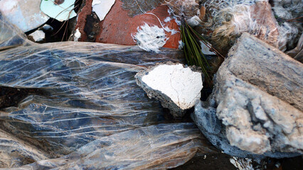 Waste from construction work close-up, illegal dumping of garbage in nature, environmental pollution, environmental disaster France, Europe