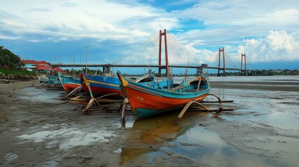 Fototapeta premium Fishing boats waiting for high tide to go back to the sea. Captured at Suramadu bridge area, Surabaya Indonesia, Aug 2015.