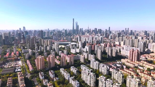 The drone aerial footage of residential district in Pudong with skyscrapers in the background, Shanghai, China.	