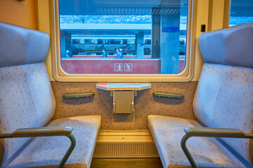 Cozy Train Seats with a Scenic View Through the Window