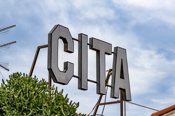 A large sign with the letters CITA on it