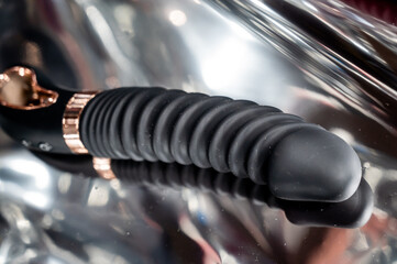 Sex toy on metal background. 