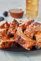 saucy bbq ribs served on a plate
