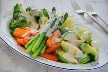 mixed vegetables, steamed and topped with a cheese sauce