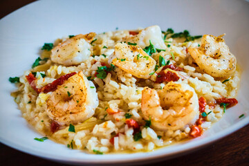 sautéed shrimp served over vegetable parmesan risotto