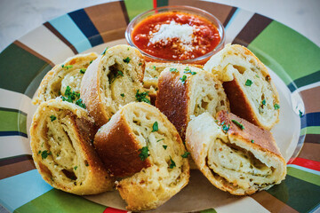cheese stromboli topped with grated parmesan served with a marinara dipping sauce