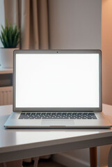 Fototapeta premium A sleek modern laptop placed on a minimalist desk, with a bright, blank white screen