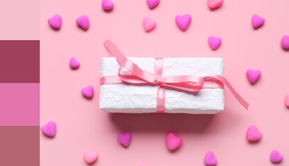 Gift box and hearts on pink background. Valentine's Day celebration