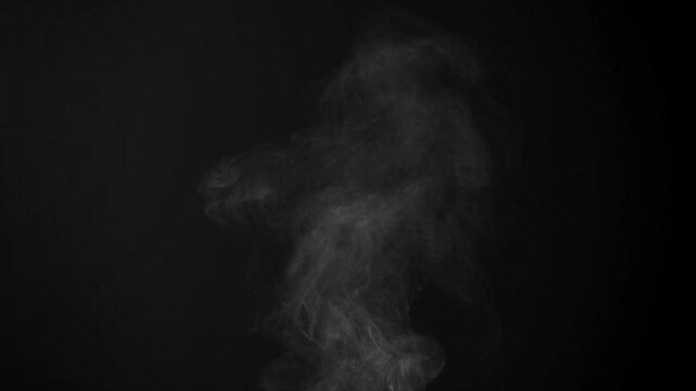 Steam, smoke, vapor isolated on black background. Smoke steam spray, abstract vaporing water, texture of cold mist, hot vapor, fog effect closeup, black screen. Hot food, drink. For overlay using