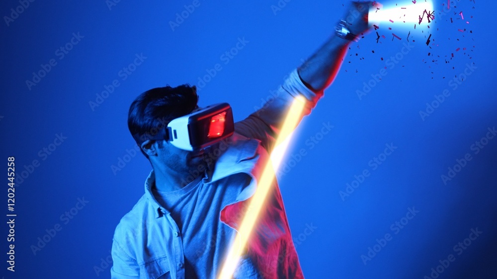 Aufkleber gamer playing game while holding glowing sword and wearing vr glasses. attractive male model excited