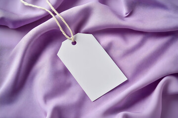 Blank Tag on Lavender Silk Fabric: Elegant Mockup for Branding and Design