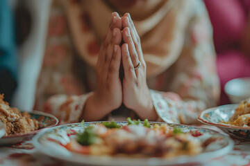 Gratitude Before Meal: A Person's Hands Folded in Prayer Before a Delicious Dish