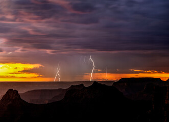 USA, Arizona, Grand Canyon National Park. Thunderstorm and lightning on North Rim at sunset.