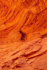 USA, Arizona, Monument Valley Navajo Tribal Park. Honeymoon Arch shelter in rock overhang.