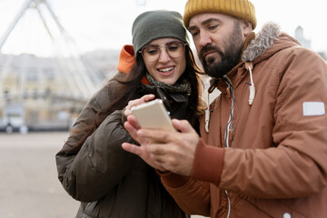 Tourists using smartphone app, exploring the city using mobile phone gps