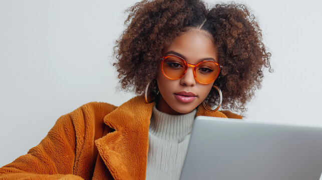 Creative young woman in bold-colored glasses and a stylish jacket