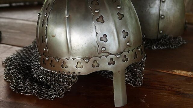 Close-up of a medieval Viking helmet, smooth camera movement, selective focus.
