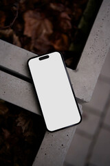 Smartphone mockup on a concrete surface top view street view