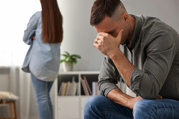 Obraz premium Offended couple ignoring each other at home, selective focus