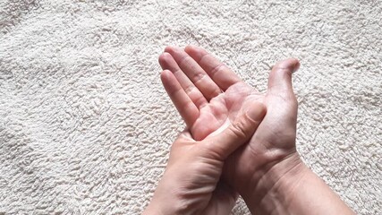 Hand massage applying cream close-up, Self-care, moisturizing, skin protection, anti-aging care. woman rubs in a healing ointment for joint pain and massages her hands