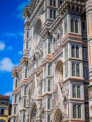 Fototapeta premium Cathedral of Santa Maria del Fiore. Fragments and elements of Florence Duomo basilica facade. Close up dome photo