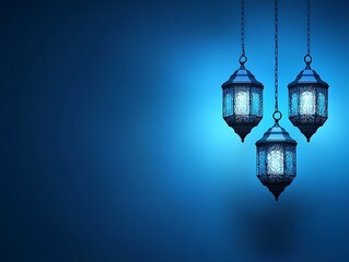 Three Illuminated Lanterns Hanging Against A Blue Background