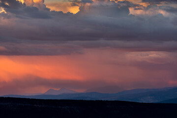 USA, Colorado, Uncompahgre National Forest. Clouds over the Cimarron Range at sunset.