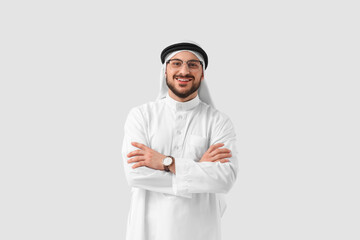 Arab businessman in eyeglasses on light background