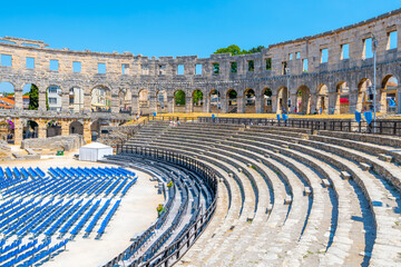 The Roman amphitheatre in Pula, Croatia, features well-preserved stone structure with seating for...