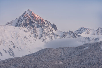 USA, Colorado, San Juan Mountains. Snow covers Mt. Sneffels at sunset.
