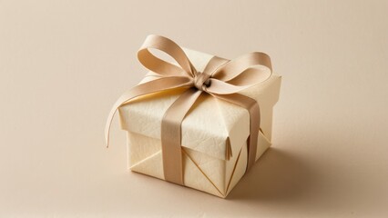 Stylish ivory bonbonniere with gold flower and ribbon, great for celebrations and favors.