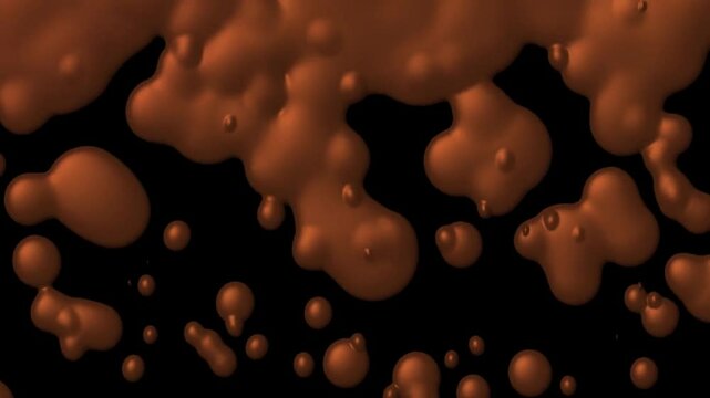 Liquid drops of chocolate colors fall down and combine against a black background.