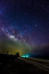 Stars, Milky Way and beach looking south to Marco Island, Florida.