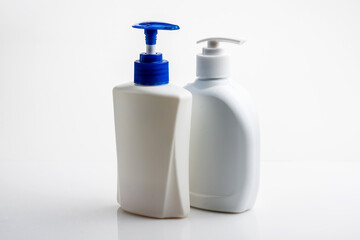 Mockup of white plastic bottle for liquid soap or shampoo with blank label.