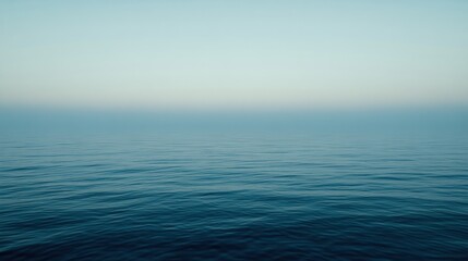 Obraz premium Calm ocean surface at dawn.