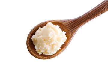 Spoon with shea butter isolated on a white background