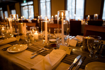 Elegant candlelit banquet hall decorated for a wedding reception