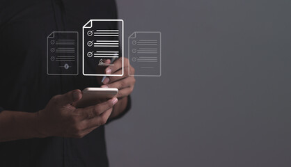 Young man with smartphone mobile hand using a pen touching to sign a Online Business Contract, Electronic signature, Contract signing, Digital documents, Future smart contract