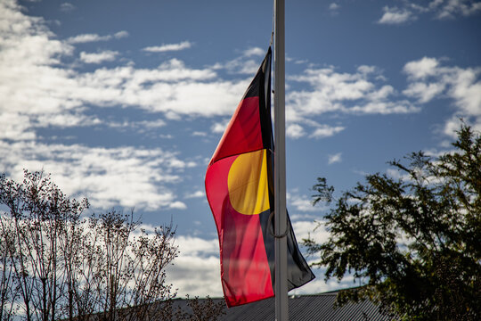 WELLINGTON NSW AUSTRALIA: 2 June 2024- Australian Aboriginal flag flying in front of Health Service in small town