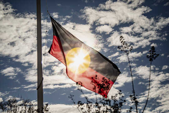WELLINGTON NSW AUSTRALIA: 2 June 2024- Australian Aboriginal flag flying in front of Health Service in small town