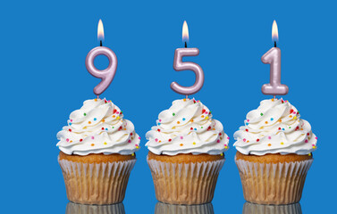Birthday Cupcakes With Candles Lit Forming The Number 951