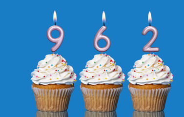 Birthday Cupcakes With Candles Lit Forming The Number 962