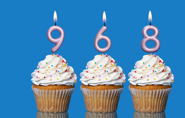 Birthday Cupcakes With Candles Lit Forming The Number 968