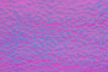 Futuristic glowing gradient background in blue and pink tones.