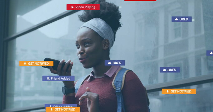 Image of icons and data processing over african american woman using smartphone - Powered by Adobe